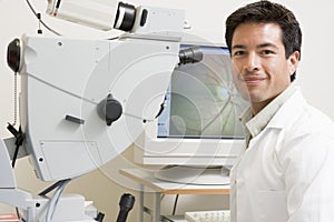 Doctor Next To Equipment To Detect Glaucoma photo