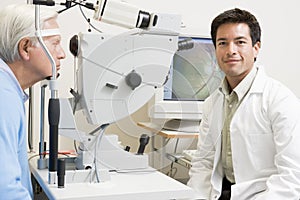 Doctor Next To Equipment To Detect Glaucoma photo