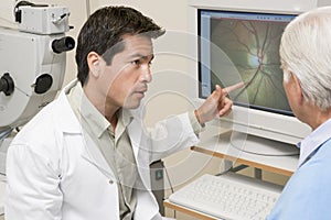 Doctor Next To Equipment To Detect Glaucoma