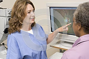 Doctor Next To Equipment To Detect Glaucoma photo