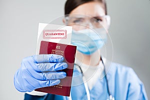Doctor or nurse at airport customs security check holding a passport