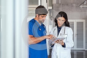 Doctor and nurse discussing report