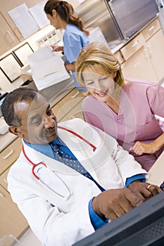 A Doctor And Nurse Discussing Something