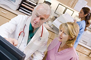 A Doctor And Nurse Discussing something