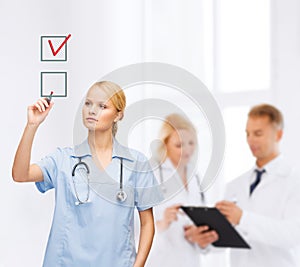 Doctor or nurse drawning checkmark into checkbox