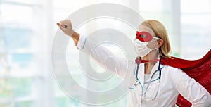 Doctor or nurse in face mask and superhero cape