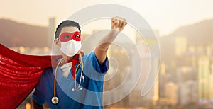 Doctor or nurse in face mask and superhero cape