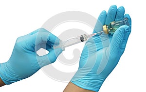 Doctor or nurse hand blue glove holding syringe and brown bottle ampoule for injection on white background with clipping paths.