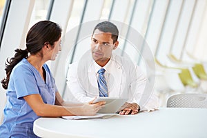 Doctor And Nurse Having Informal Meeting In Hospital Canteen photo