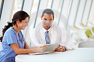 Doctor And Nurse Having Informal Meeting In Hospital Canteen photo