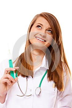 Doctor or nurse holds a syringe, healthcare concept