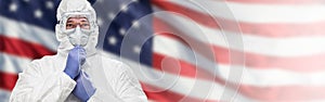 Doctor or Nurse In Medical Personal Protective Equipment PPE Against The American Flag Banner