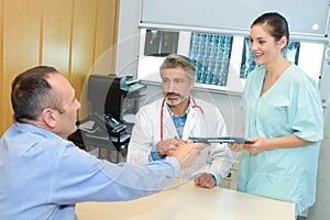 doctor with nurse and patient