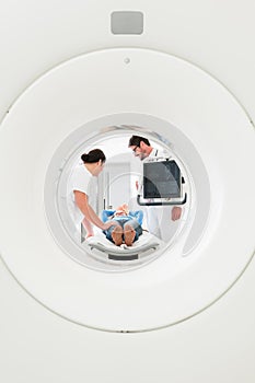 Doctor, nurse, and patient at CT scan