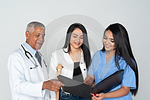 Doctor and Nurse With Patient On White Background