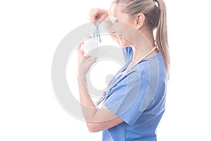 Doctor of nurse putting on a surgical mask