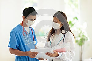 Doctor or nurse with stethoscope and face mask