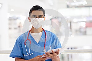 Doctor or nurse with stethoscope and face mask