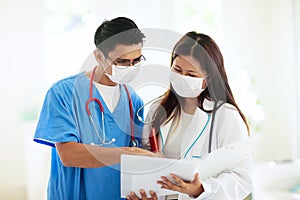 Doctor or nurse with stethoscope and face mask