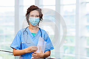 Doctor or nurse with stethoscope and face mask