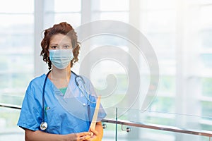 Doctor or nurse with stethoscope and face mask