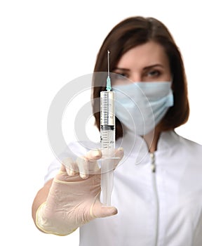 Doctor or nurse with syringe needle for flu injection vaccination concept