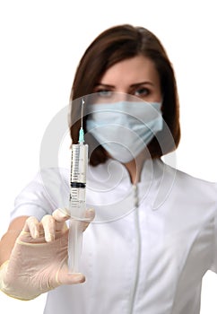 Doctor nurse with syringe needle ready for flu injection vaccination concept