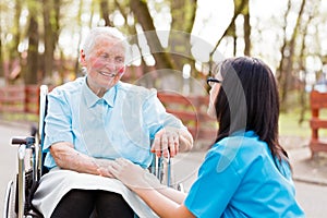 Doctor, Nurse Talking With Kind Lady