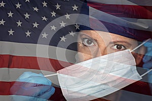 Doctor or Nurse Wearing Medical Face Mask and Scrubs with Ghosted American Flag