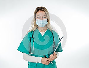 Doctor or nurse wearing scrubs and protective medical face mask. Medicine and health care workers