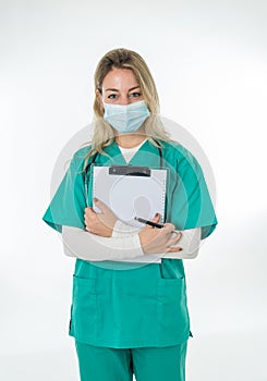 Doctor or nurse wearing scrubs and protective medical face mask. Medicine and health care workers