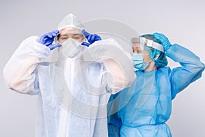 Doctor and nurse during work shift in medical protective equipment. The concept of combating pandemic and covid 19