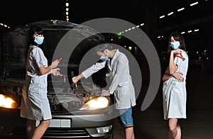 The doctor and nurses repair the car