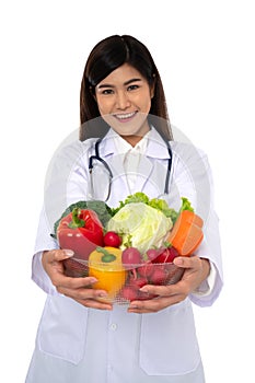 Doctor or nutritionist holding fresh fruit Orange, red and green apples and smile in clinic. Healthy diet Concept of nutrition