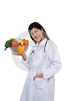 Doctor or nutritionist holding fresh fruit Orange, red and green apples and smile in clinic. Healthy diet Concept of nutrition