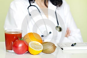Doctor nutritionist in office with healthy fruits photo