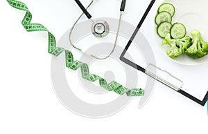 Doctor nutritionist table. Healthy and healthy food, broccoli, pickers and avacado. Stethoscope and diet pills. Top View