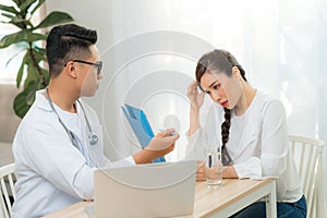 Doctor obstetrician, gynecologist or psychiatrist consulting and diagnostic examining woman patient`s obstetric - gynecological photo