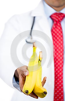 Doctor offering bananas