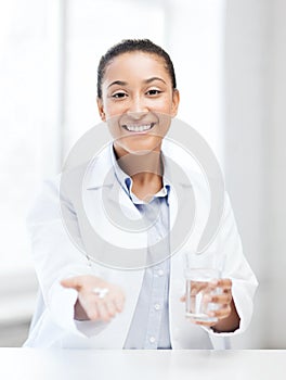 Doctor with offering pills