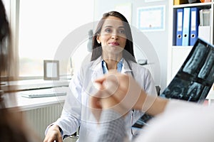 Doctor office at patient reception barely holds back photo