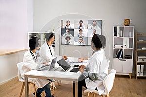 Doctor In Online Medical Video Conference With Diverse Team