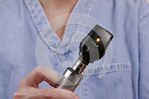 Doctor with ophthalmoscope
