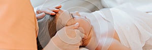 Doctor osteopath hands does physiological and emotional therapy for eight year old kid girl. pediatric osteopathy treatment sessio