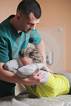 Doctor osteopath have manual therapy for woman`s neck