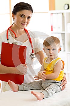 Doctor paediatrician examining kid