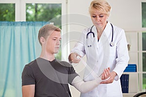 Doctor parcels patient's hand
