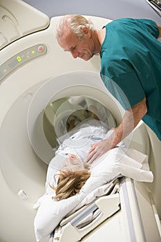 Doctor With Patient As They Have CAT Scan