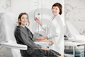 Doctor with patient during the blood purification procedure