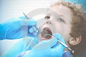 Doctor and patient child. Boy having his teeth examined with dentist. Medicine, health care and stomatology concept